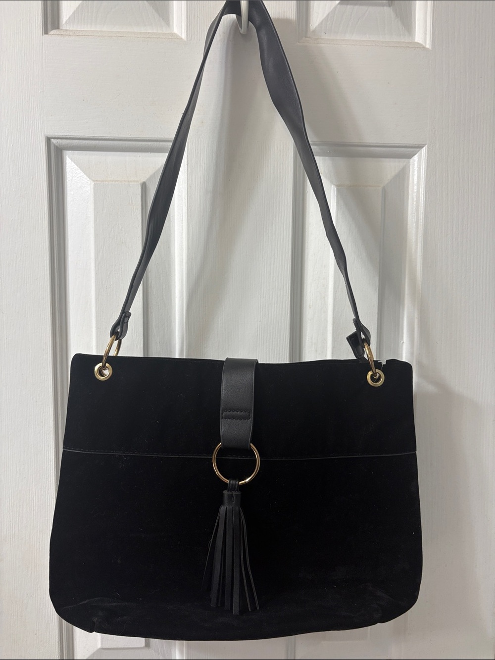Black Suede Shoulder Bag with Tassel and Gold Ring Accent